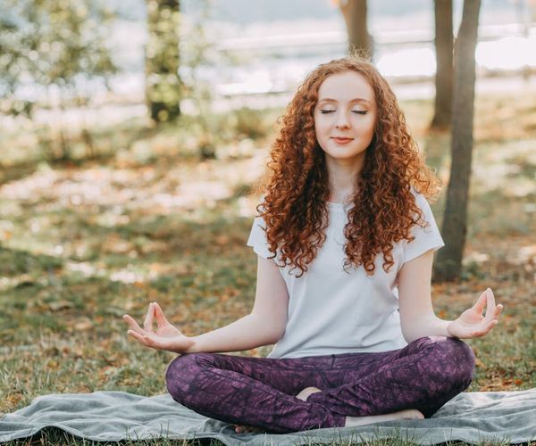 Person meditating in a calm environment, symbolizing inner balance.